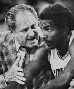 The colorful Guy Lewis coaches up Clyde Drexler at the University of Houston.