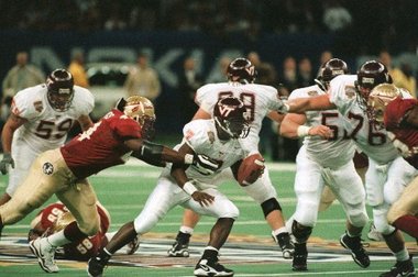 Virginia Tech quarterback Michael Vick tries to escape the talented Florida State pass rush (Credit The Times Picayune)