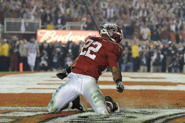 Alabama running back, the school's first ever Heisman Trophy winner, celebrates after sealing a B.C.S. Championship Game victory over the Texas Longhorns.