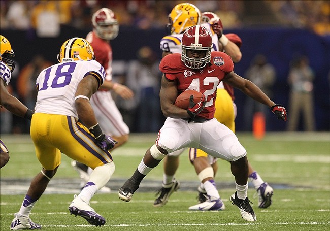 Alabama running back Eddie Lacy shakes LSU's Brandon Taylor in a 21-0 win for the Crimson Tide in their much-anticipated rematch in the Superdome.