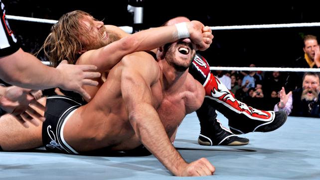Corporate Kane puts Daniel Bryan to the test with Antonio Cesaro. [Photo courtesy of WWE.com]