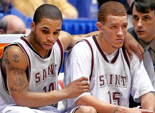Future NBA players Jameer Nelson and Delonte West comfort each other after Saint Joseph's perfect season goes down against Xavier in the A-10 Tournament. They would go on to lose in the Elite Eight to Oklahoma State.